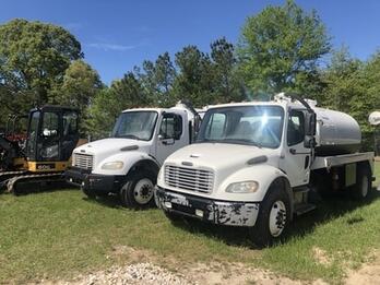 Septic maintenance trucks waiting to be dispatched in Columbus, Ga