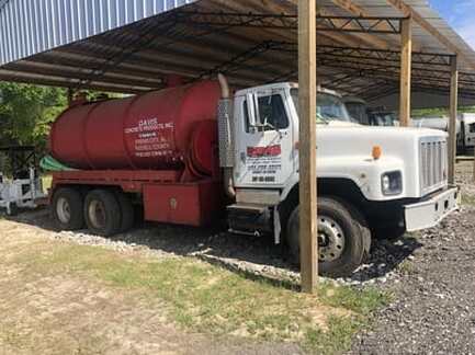 Red septic pumping truck in Phenix City, Al